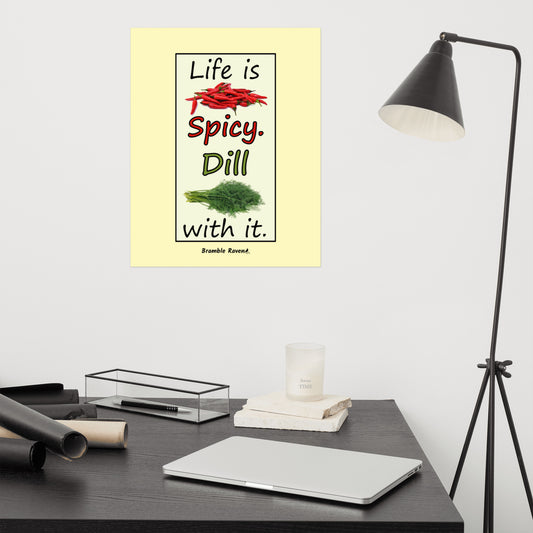 Life is spicy. Dill with it. Phrase with images of chili peppers and dill weed. Rectangular frame for saying on pale yellow background. 16 by 20 inch enhanced matte paper poster. Shown above desk by a lamp.