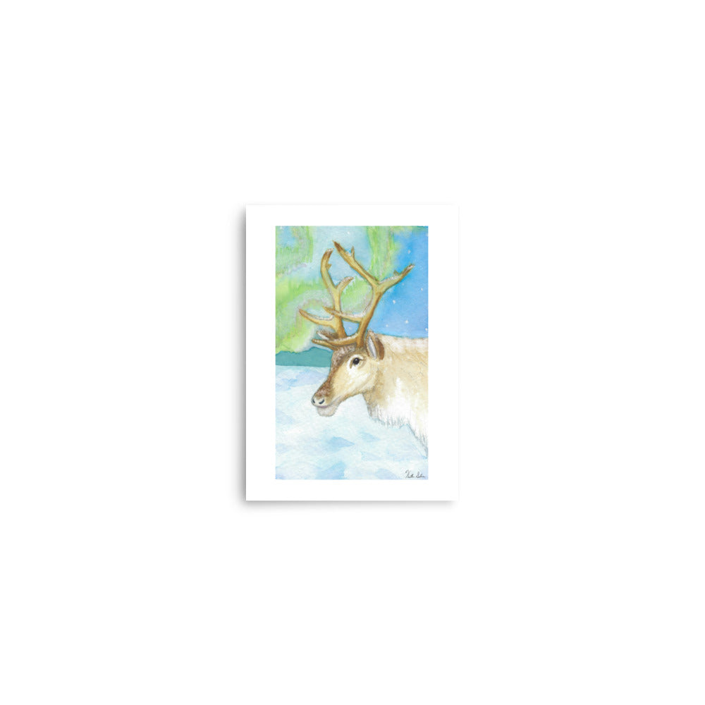 5 by 7 inch art poster print. Watercolor painting of a snowy reindeer with the northern lights in the background.