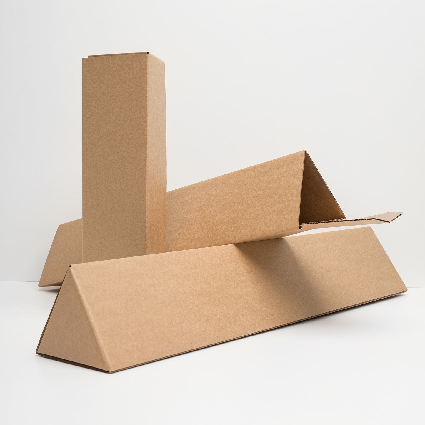 Triangular cardboard shipping tube to provide optimal protection of art print during shipping.