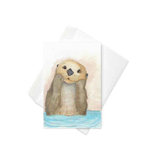 4 by 6 inch greeting card. Front cover features watercolor print of a sea otter entitled Otter Amazement. Comes with a white envelope. Inside is blank. Made with durable paperboard and vibrant printing.