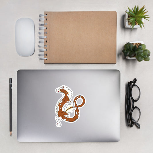 5.5 inch vinyl kiss-cut sticker with white border. Features Nikolai the rootbeer float Fuzzy Noodle Dragon. Shown on a laptop.