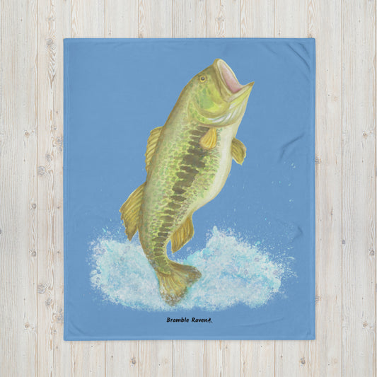 50 by 60 inch soft throw blanket. Features original watercolor painting of a largemouth bass leaping from the water.