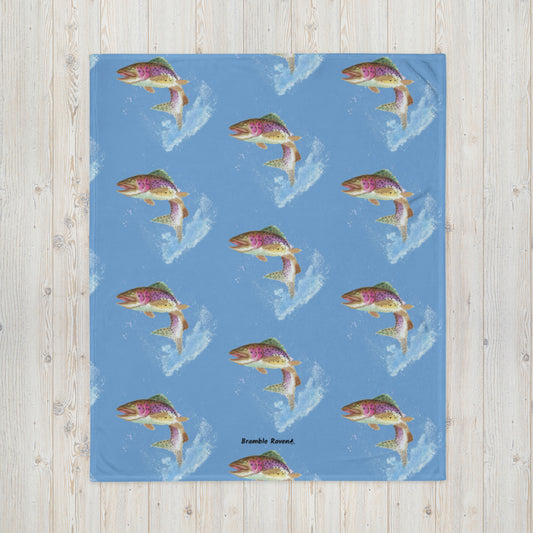 50 by 60 inch soft throw blanket. Features original watercolor painting of  rainbow trout leaping from the water in a pattern across a blue background.