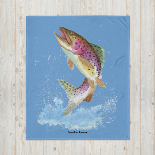50 by 60 inch soft throw blanket. Features original watercolor painting of a rainbow trout leaping from the water on a blue background.