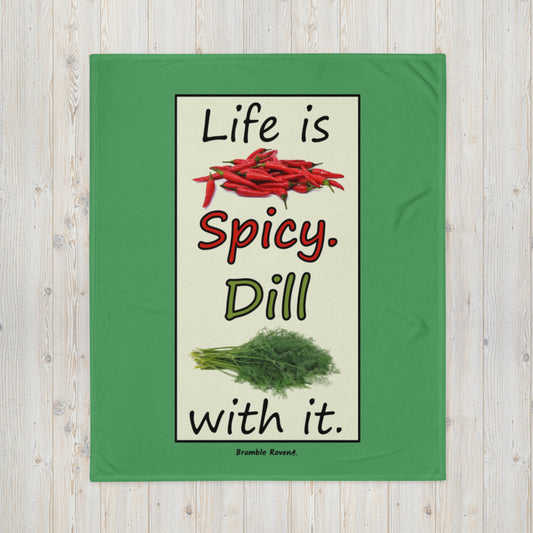 Life is spicy. Dill with it. Phrase with images of chili peppers and dill weed. Rectangular frame for saying on green blanket. 50 by 60 inches soft touch polyester. White fabric on the reverse side.