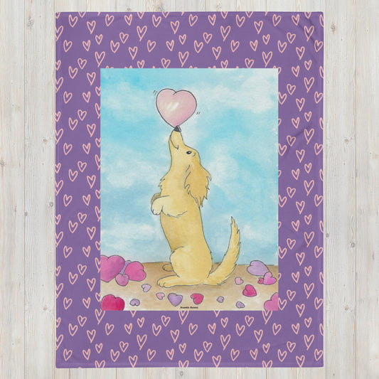 60 x 80 inch Puppy Love throw blanket. Silk soft polyester fabric. Watercolor print of dog balancing a heart on its nose, surrounded by purple trim with pink hearts. Machine washable, hypoallergenic, and flame retardant.