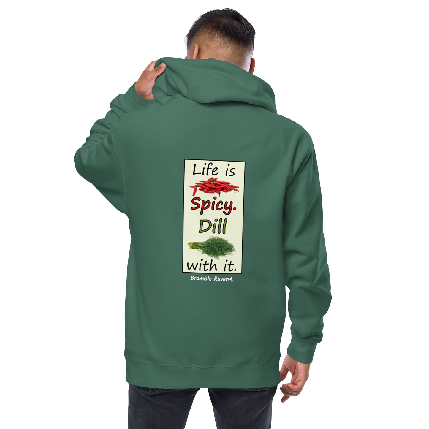 Life is spicy. Dill with it. Text with image of chili peppers and dill weed. Graphic printed on the back of unisex alpine green zip up hoodie. Shown on male model.