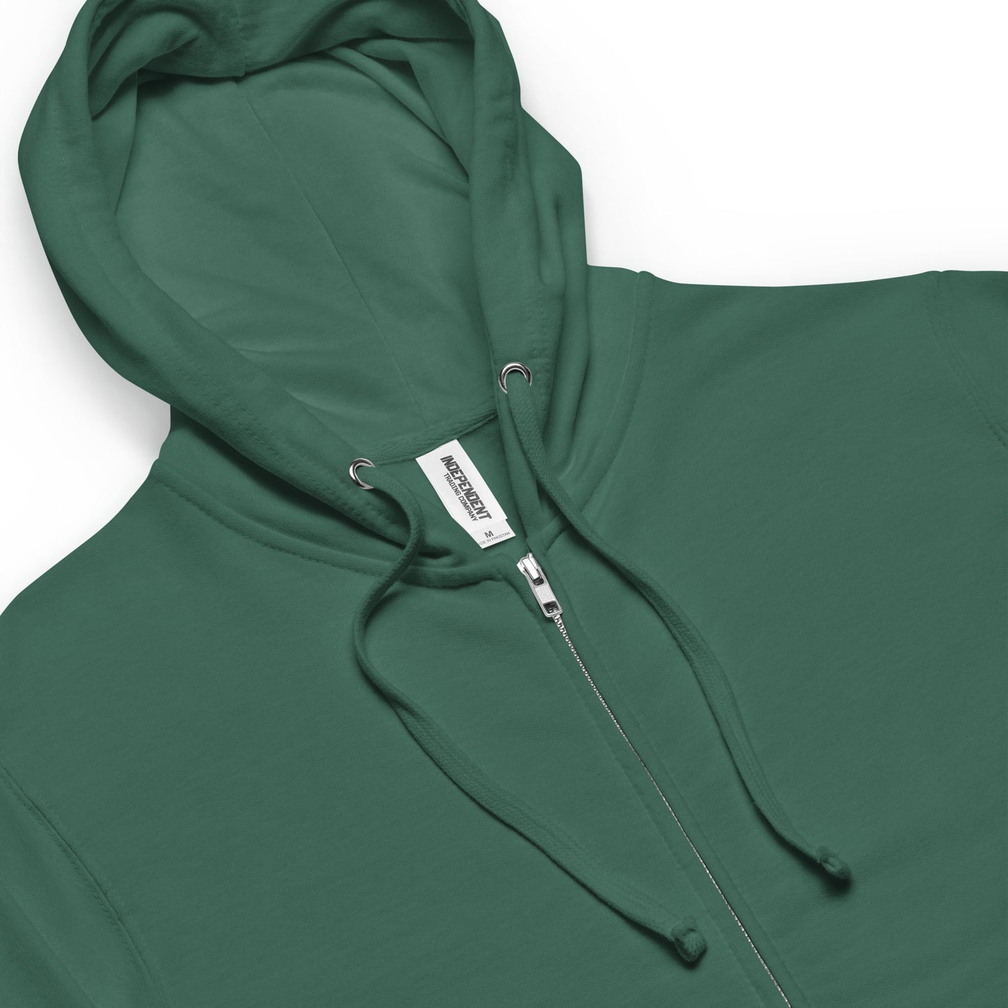 Alpine green colored unisex fleece zip up hoodie. Back design features a watercolor fox in the grass with ferns and mushrooms. Has a jersey-lined hood, metal eyelets and zipper. Detail image shows jersey-lined hood, metal eyelets, draw cords and zipper.