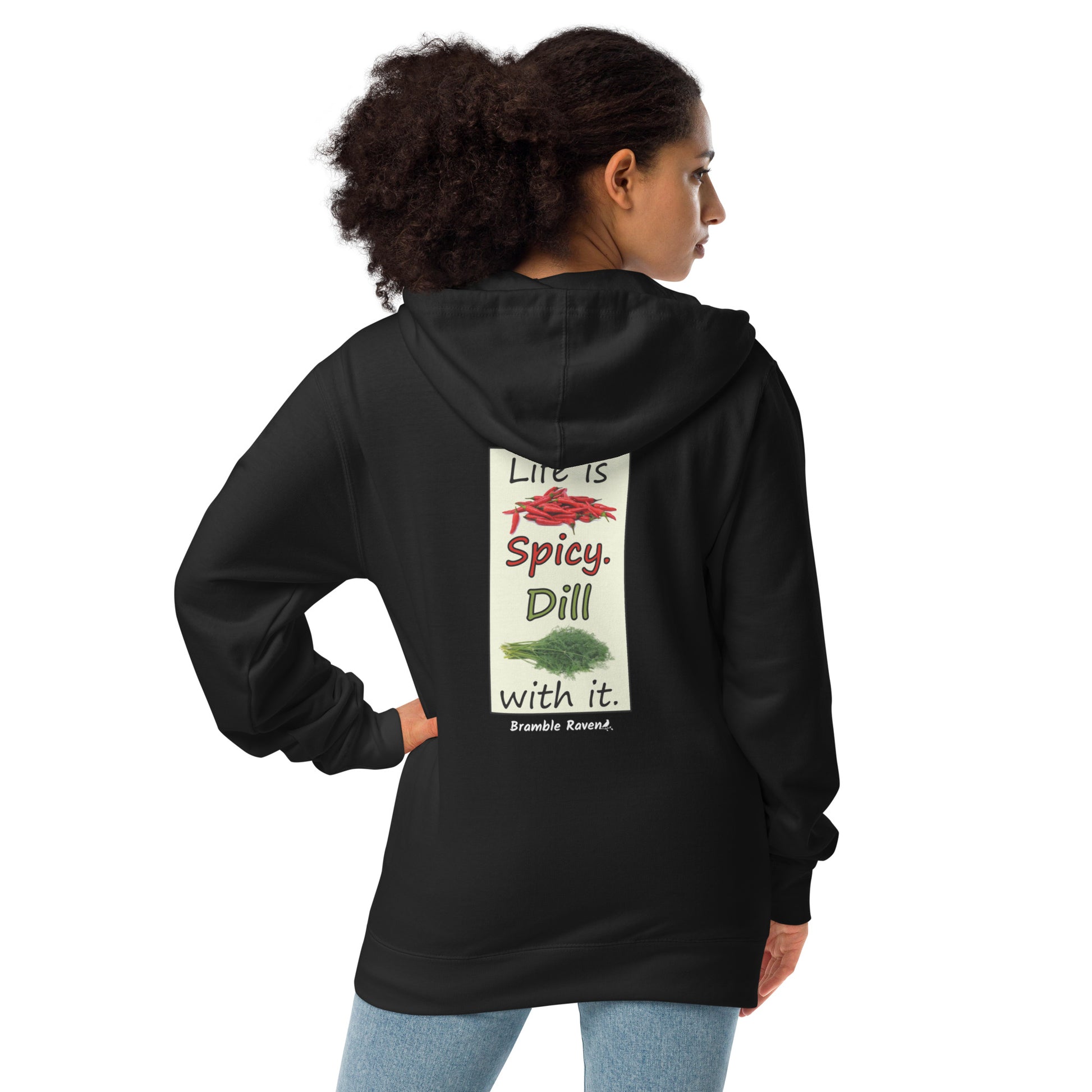 Life is spicy. Dill with it. Text with image of chili peppers and dill weed. Graphic printed on the back of unisex charcoal black zip up hoodie. Shown on female model.