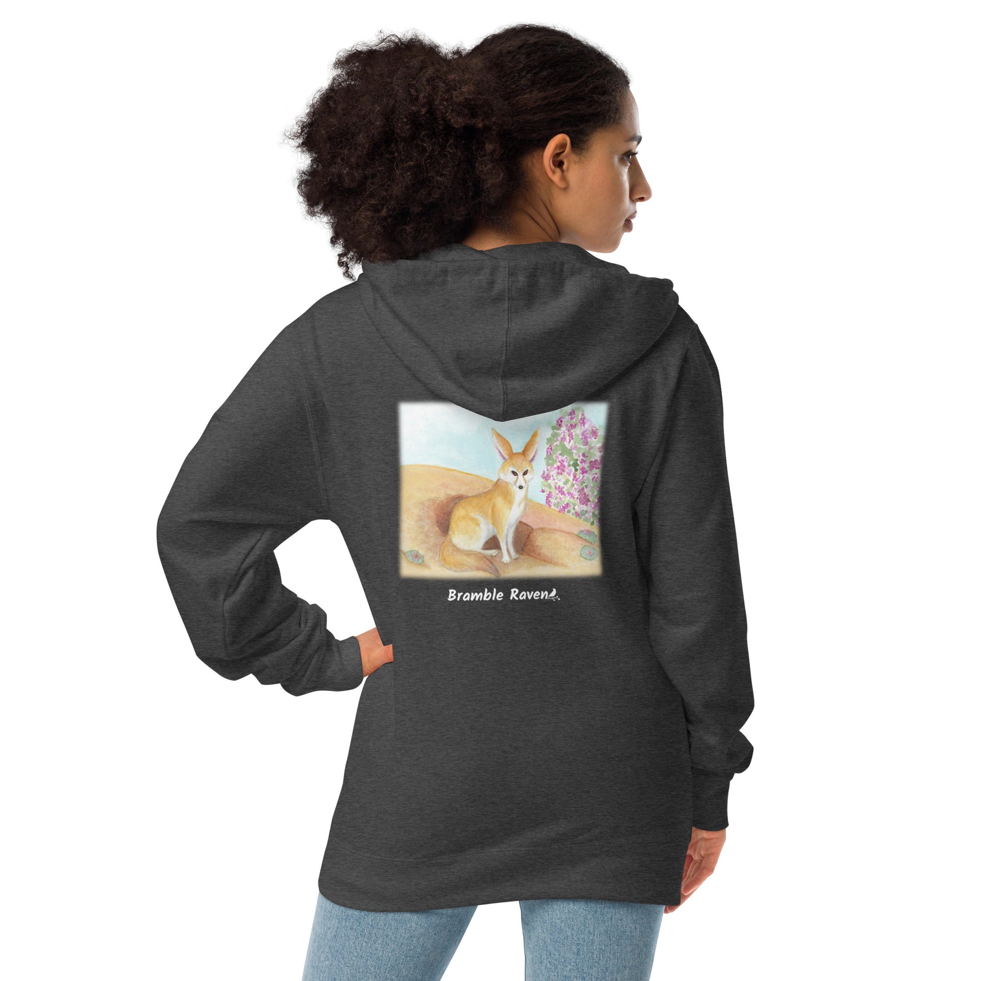 Unisex fleece-lined zip-up charcoal heather grey colored hoodie. Features original watercolor painting of a fennec fox in the desert on the back of the hoodie. Shown on female model.