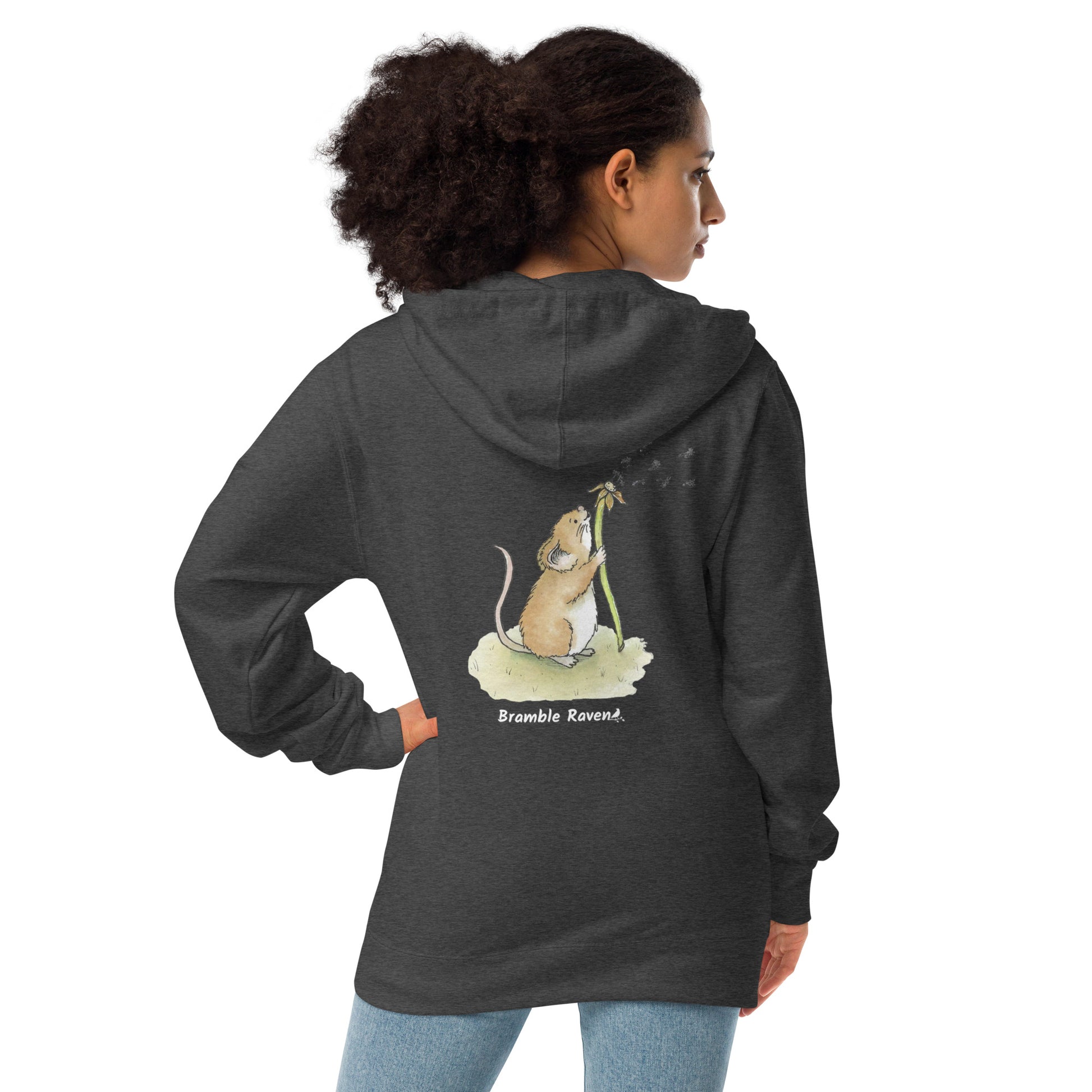 Dandelion wish design of cute watercolor mouse blowing dandelion seeds on the back of a charcoal gray fleece zip up hoodie shown on female model