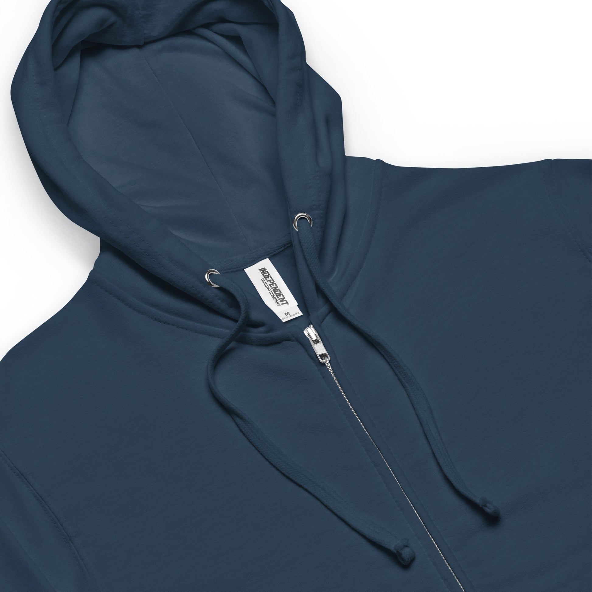 Details of unisex fleece-lined navy zip up hoodie. Image shows metal zipper, metal eyelets, matching cords, jersey-lined hood.