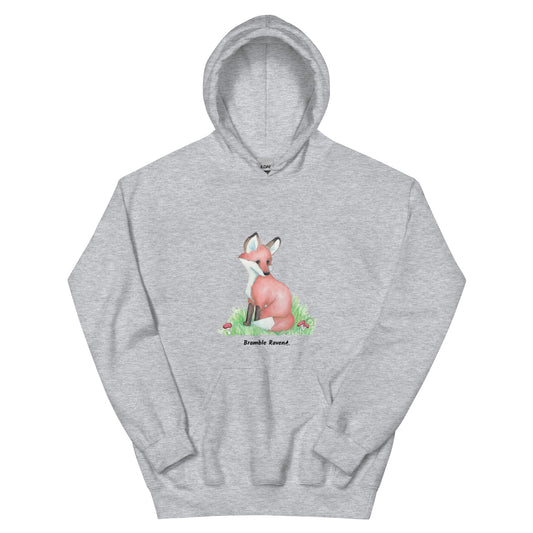 Sport grey colored unisex hoodie with watercolor print of a fox in the grass by mushrooms and ferns.
