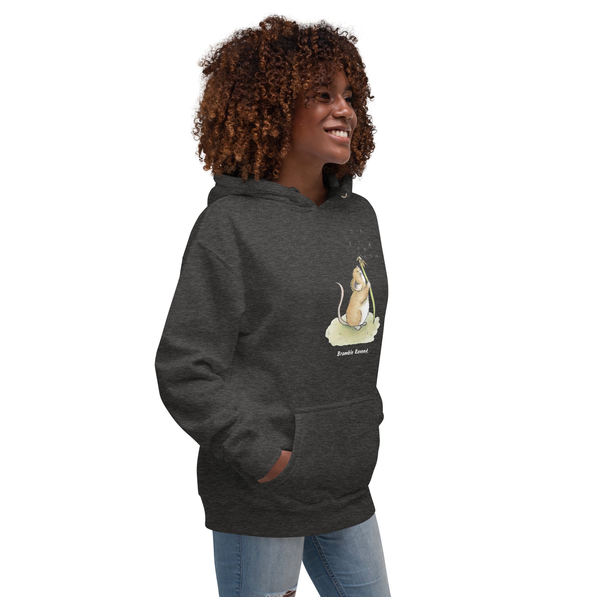 Original Dandelion wish design of cute watercolor mouse blowing dandelion seeds  featured on unisex charcoal heather gray  colored hoodie shown on female model