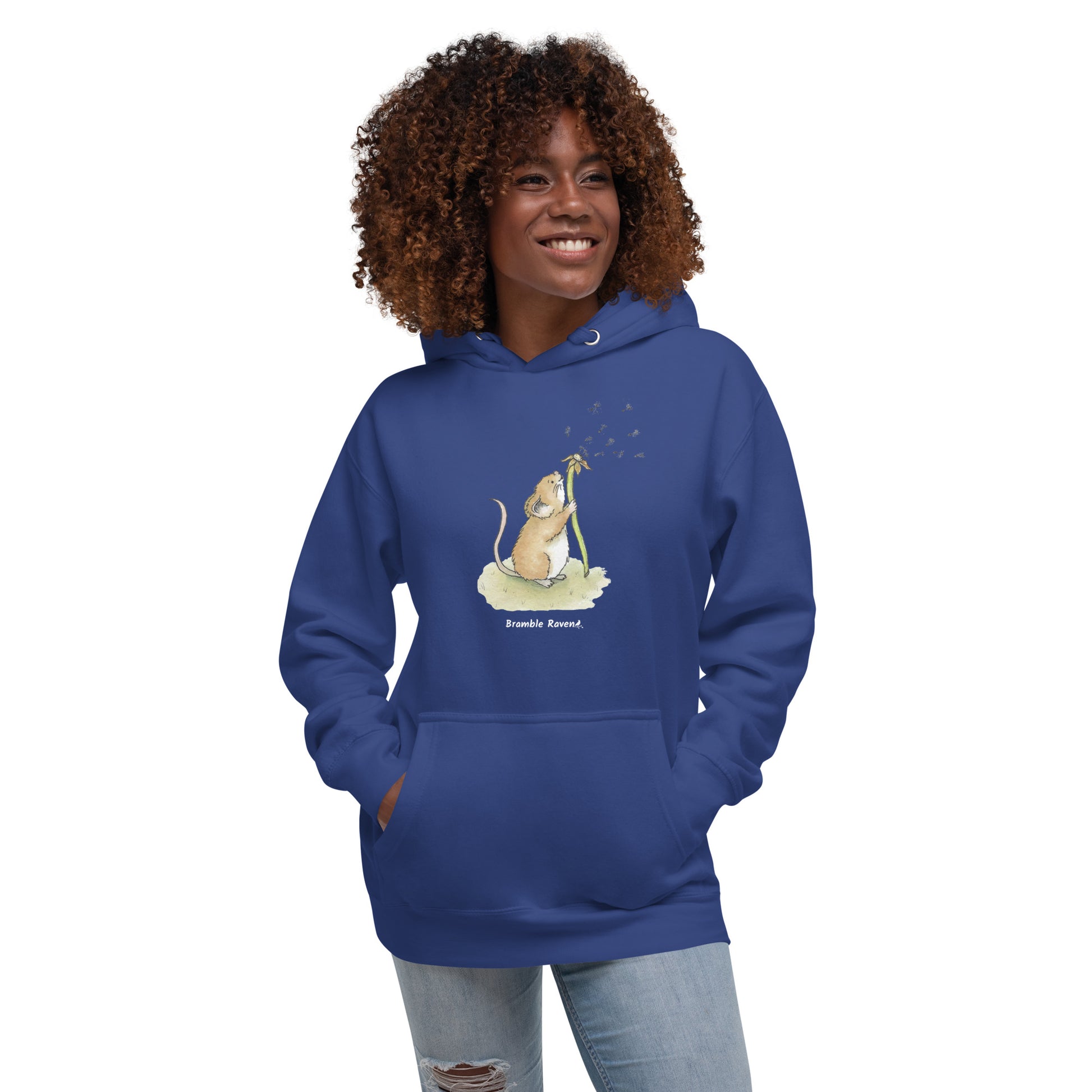Original Dandelion wish design of cute watercolor mouse blowing dandelion seeds  featured on unisex royal blue colored hoodie shown on female model