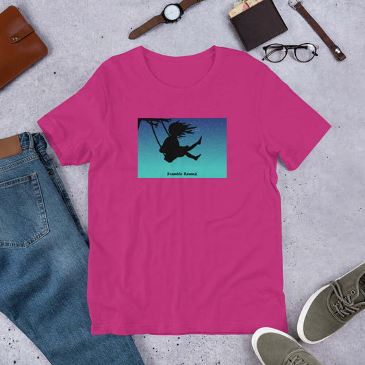 Original Swing Free design of a girl's silhouette in a tree swing against the backdrop of a blue starry sky. Rectangle design on berry pink colored unisex t-shirt.