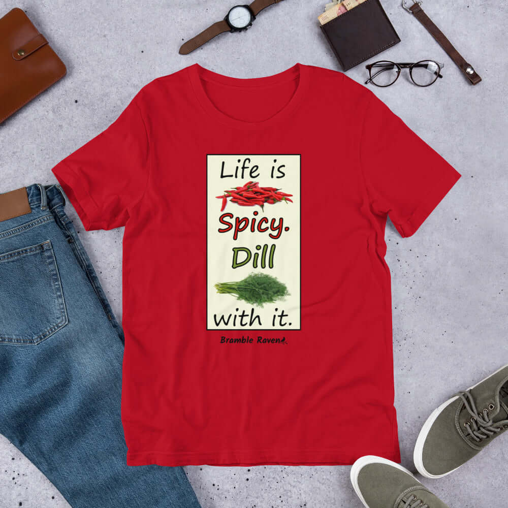 Life is spicy. Dill with it. Phrase with images of chili peppers and dill weed. Rectangular frame for saying on red colored unisex t-shirt.
