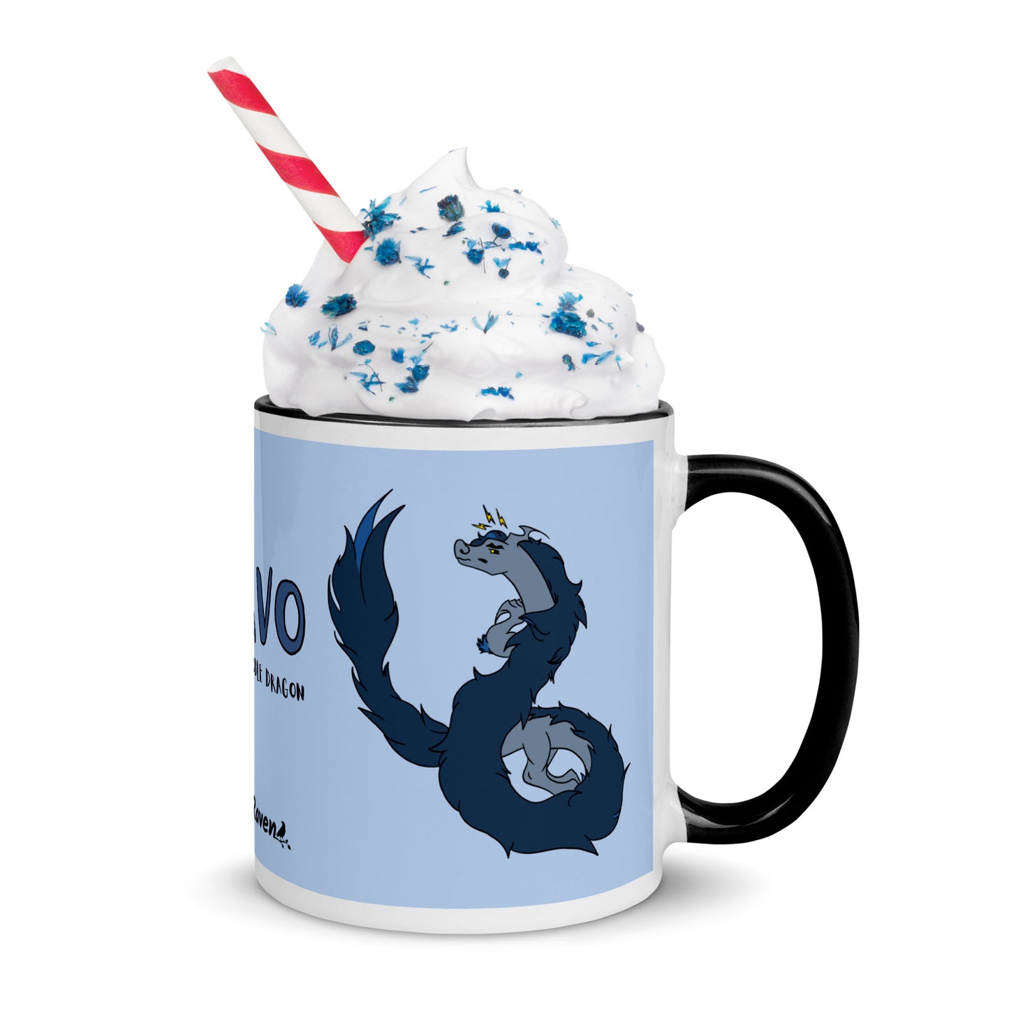 11 ounce ceramic mug featuring a double-sided image of angry Korvo the Fuzzy Noodle dragon against a light blue background.  Black inside and handle. Shown with whipped cream, sprinkles and a straw.