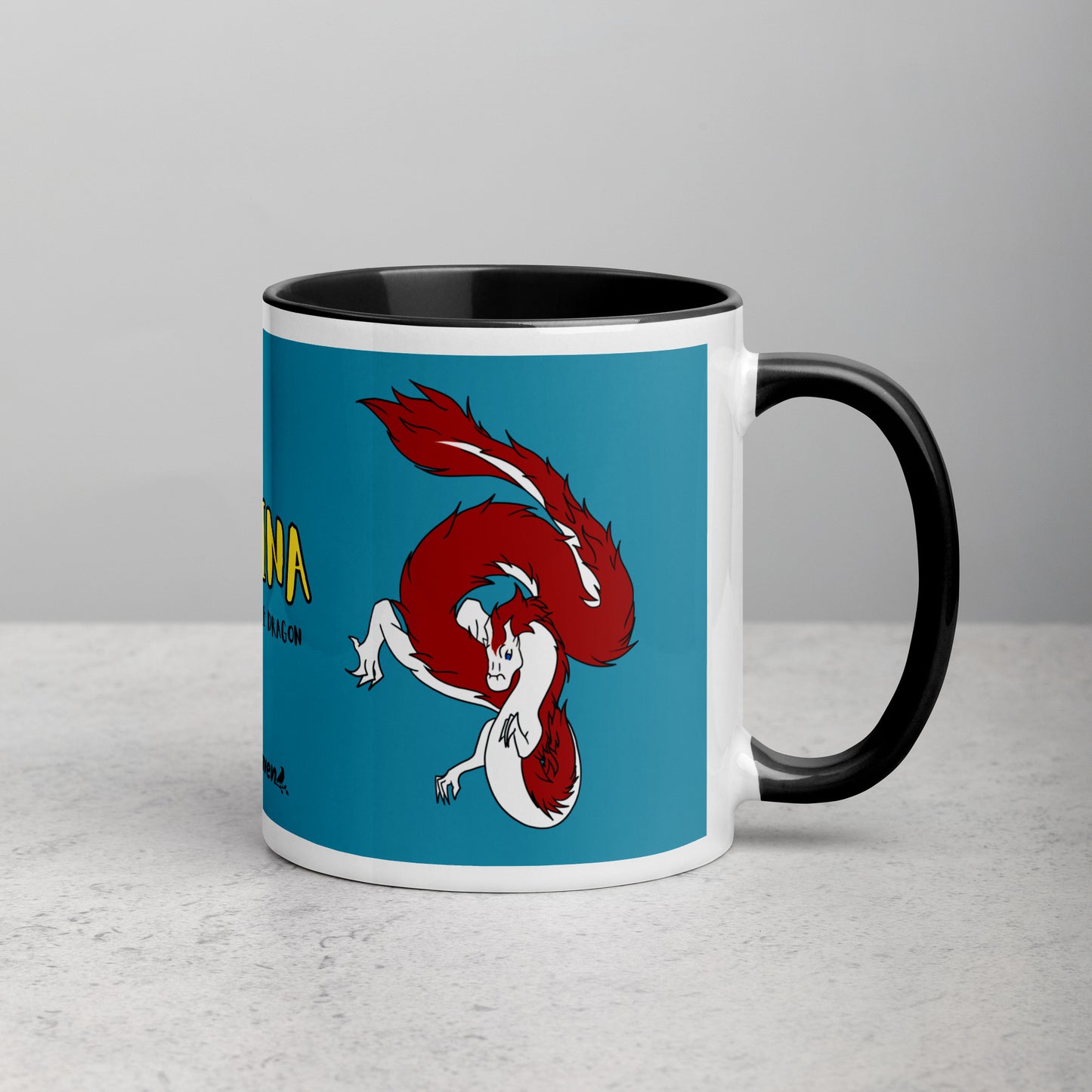 11 ounce ceramic mug with black handle, rim and inside color. Features double-sided image of Loraina the Fuzzy Noodle Dragon on a dark blue background. Mug is microwave and dishwasher safe.