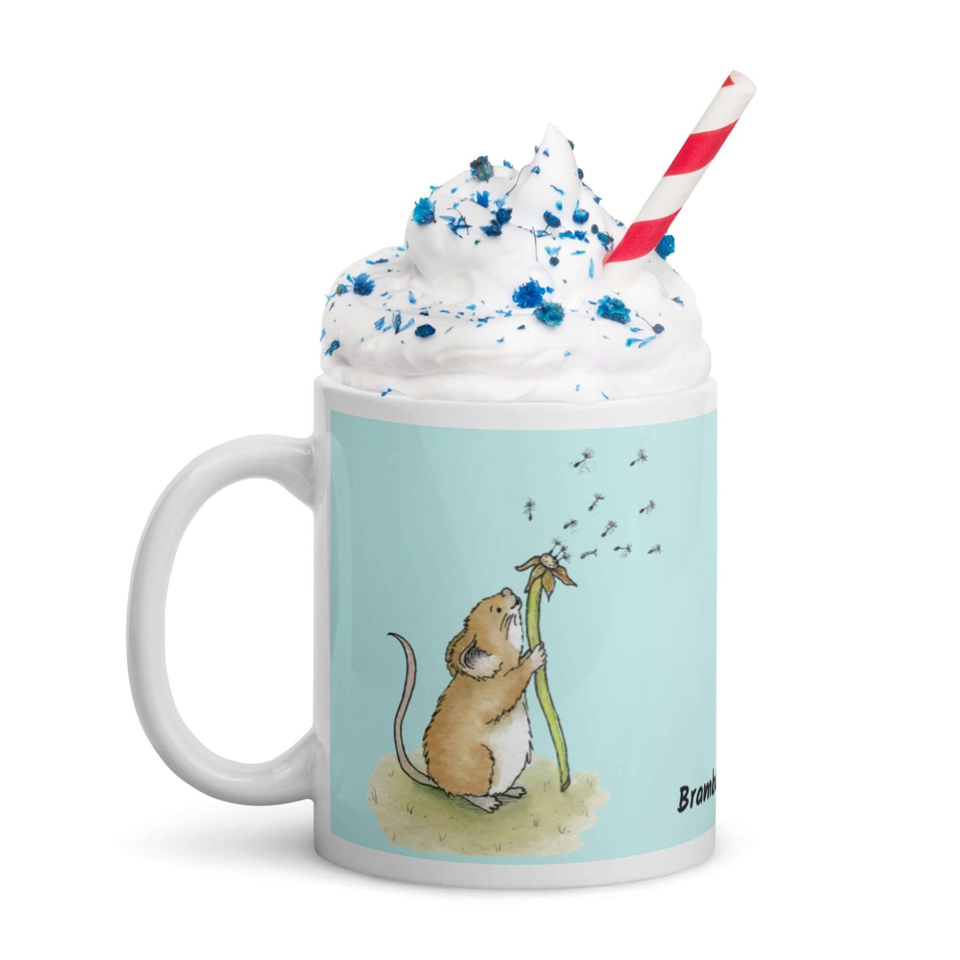 Two-sided image of original Dandelion wish design of cute watercolor mouse blowing dandelion seeds  featured on 11 ounce mug with light blue background