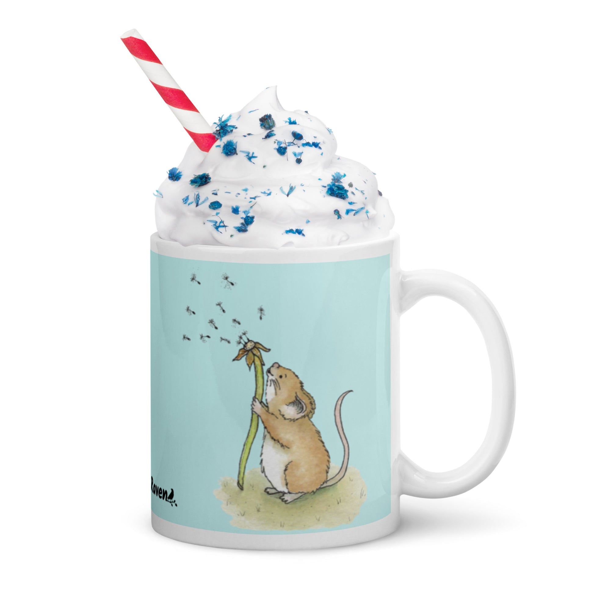 Two-sided image of original Dandelion wish design of cute watercolor mouse blowing dandelion seeds  featured on 11 ounce mug with light blue background.