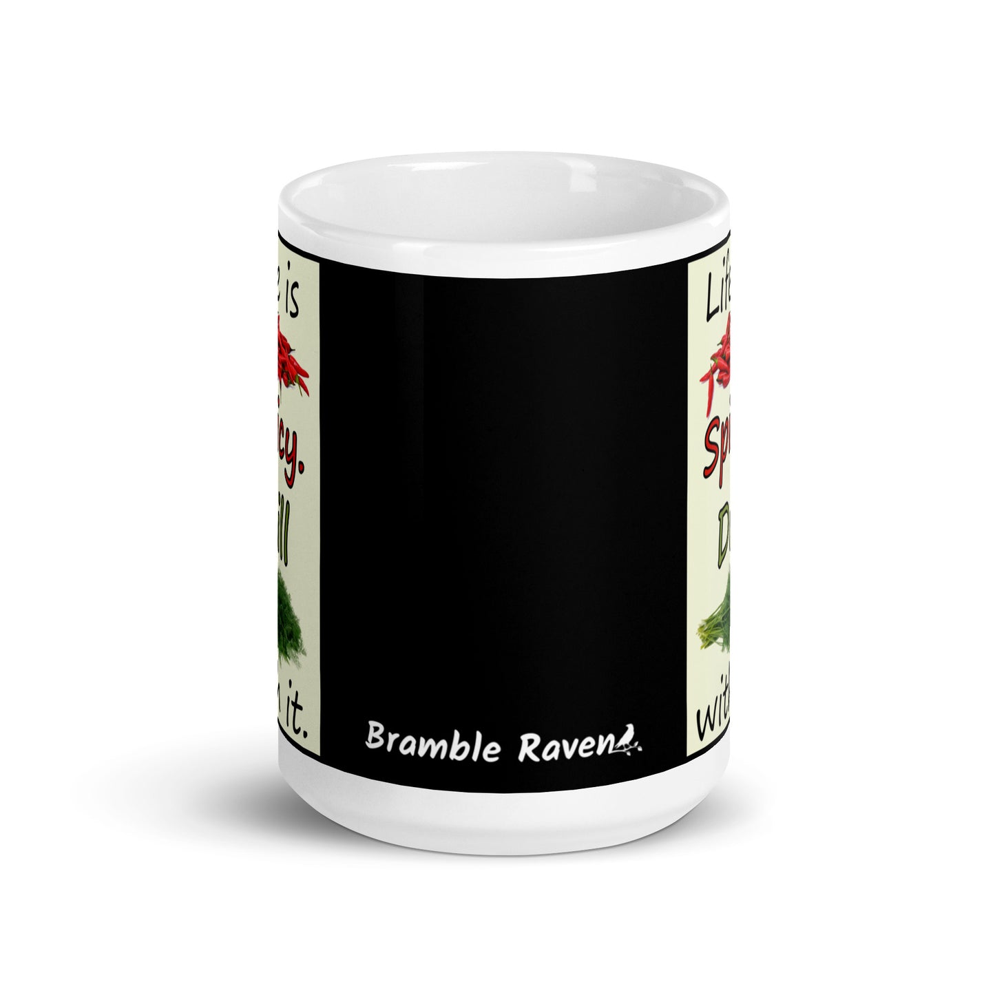 15 ounce white glossy ceramic mug. Life is Spicy. Dill with it text. Image of chili peppers and dill weed on a light yellow rectangle. Black background on mug. Front view shows white Bramble Raven logo on black background.