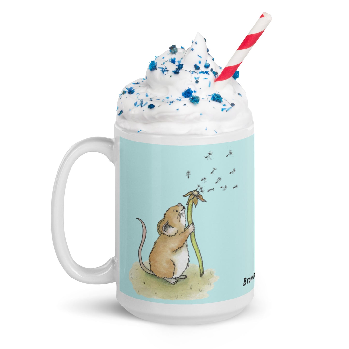 Two-sided image of original Dandelion wish design of cute watercolor mouse blowing dandelion seeds  featured on 15 ounce mug with light blue background. Handle facing left.