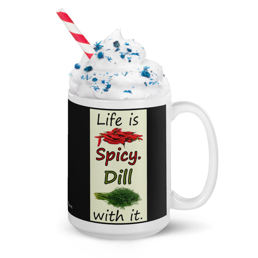 15 ounce white glossy ceramic mug. Life is Spicy. Dill with it text. Image of chili peppers and dill weed on a light yellow rectangle. Black background on mug. Shown with whipped cream, sprinkles and a straw.